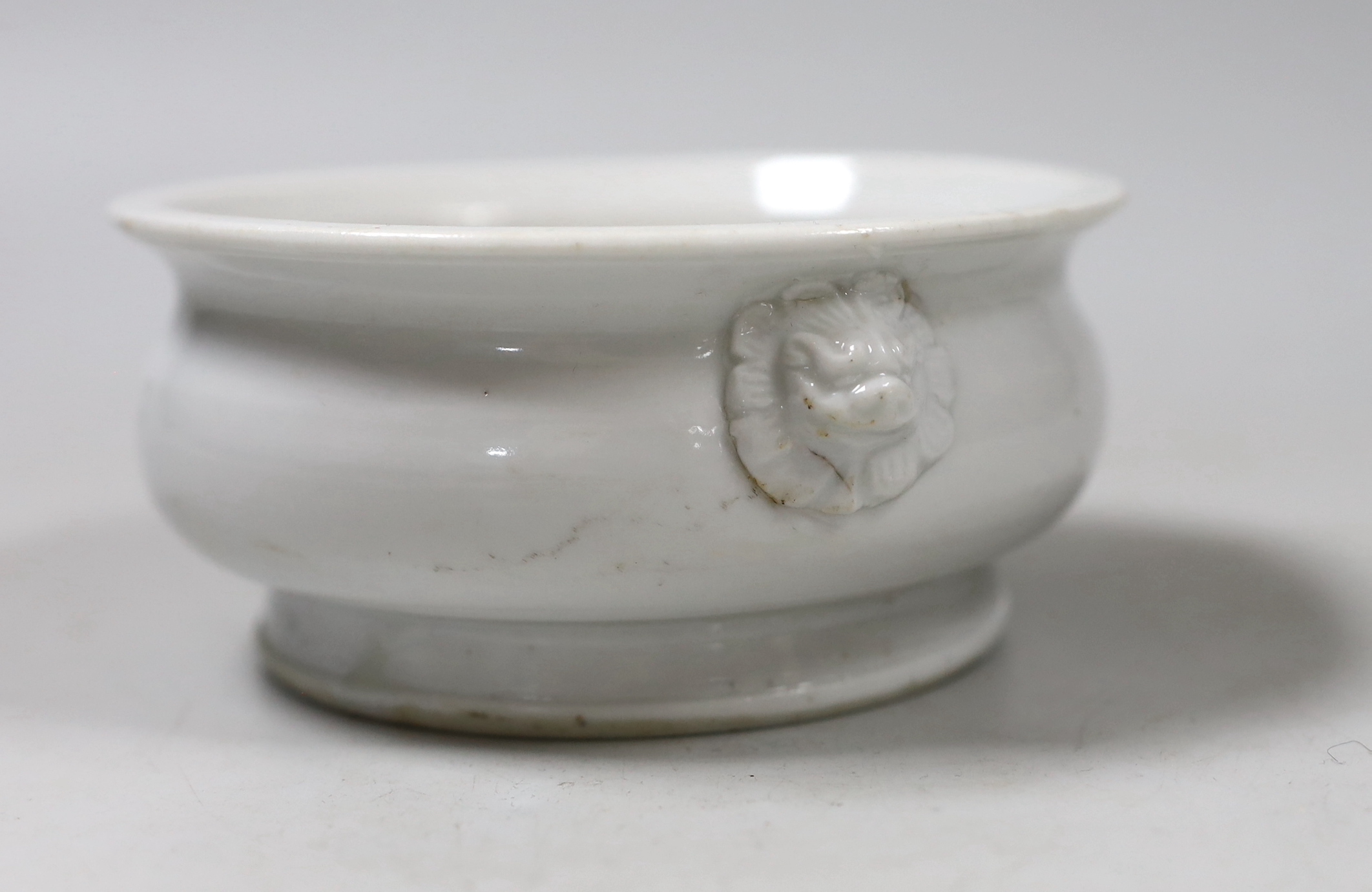 A Chinese blanc de chine two-handled censer, 12.5cm diameter